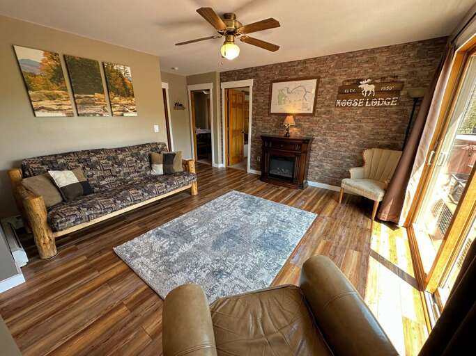 A separate living area, across from the living room, provide a quieter space for those looking for a spot to cozy up with a book while enjoying the electric fireplace and the stunning view.