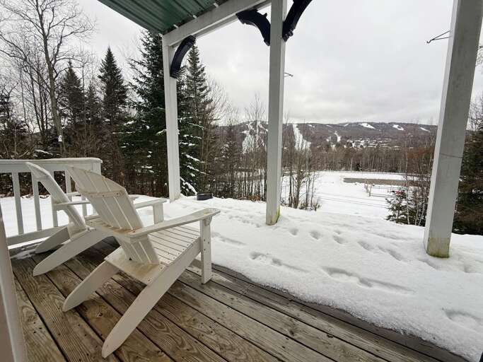 Snowy Scene With Serene Seating, Vacation Rental Porch Overlooking Wintry Woods