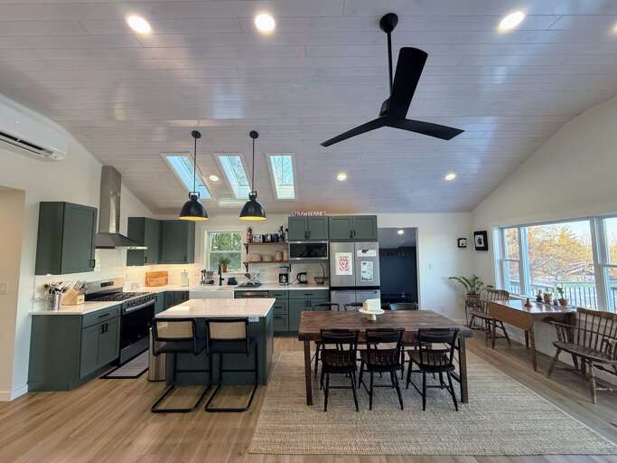 Modern open concept kitchen, living area and dining room with great views