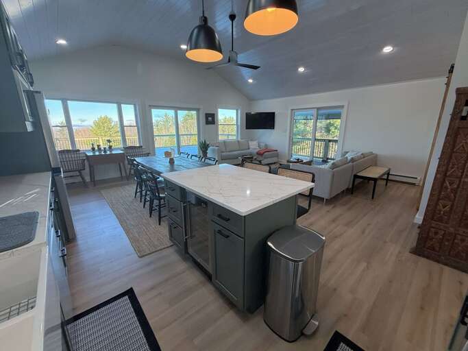 Modern open concept kitchen, living area and dining room with great views