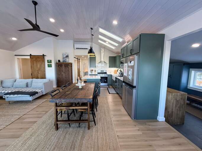 Modern open concept kitchen, living area and dining room with great views