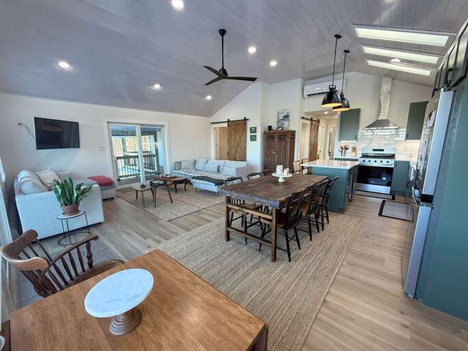Modern open concept kitchen, living area and dining room with great views