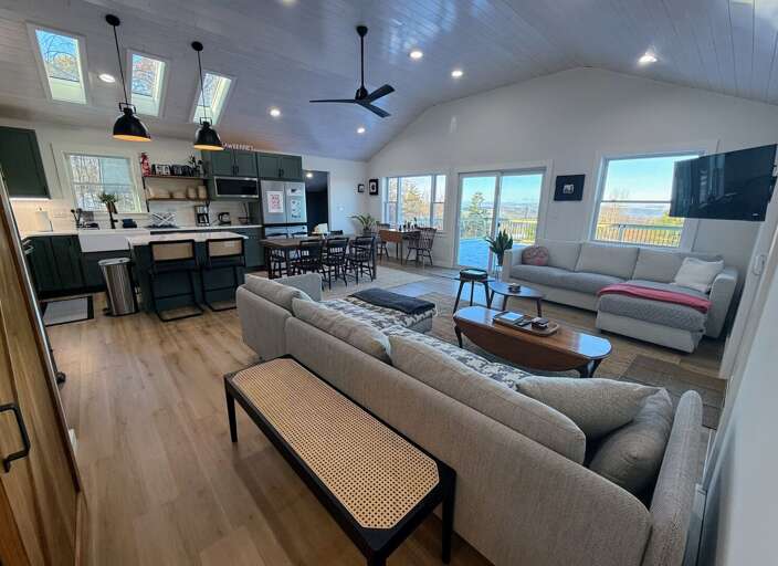 Modern open concept kitchen, living area and dining room with great views