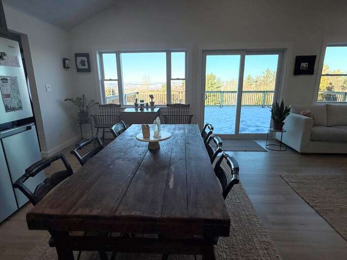 Modern open concept kitchen, living area and dining room with great views