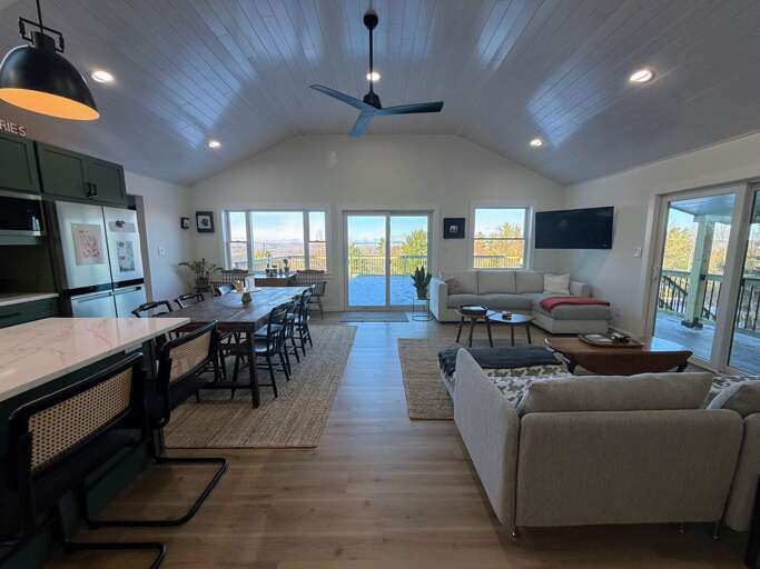 Modern open concept kitchen, living area and dining room with great views