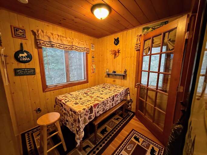 Dining table near the kitchen and entryway