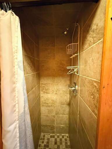 Lower Level Bathroom tiled shower