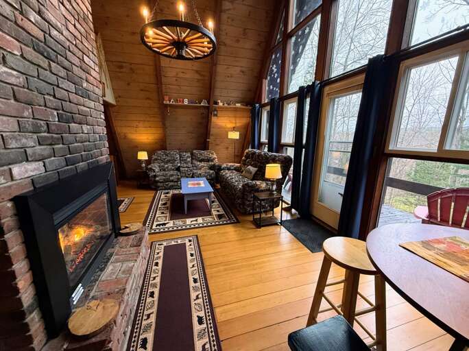 Main living area with gas fireplace and smart TV