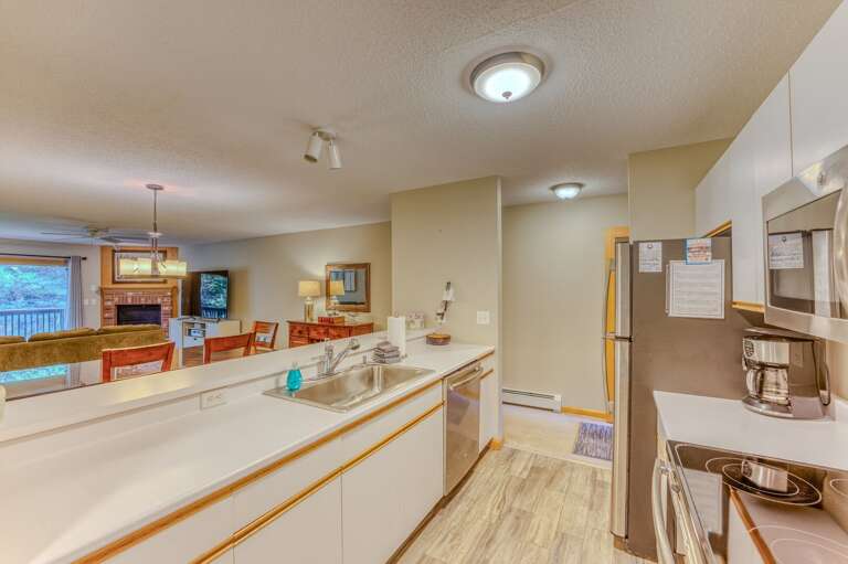 Kitchen offers stainless steel appliances and a breakfast bar for 4.