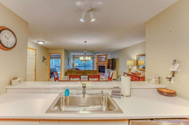 Kitchen offers stainless steel appliances and a breakfast bar for 4.