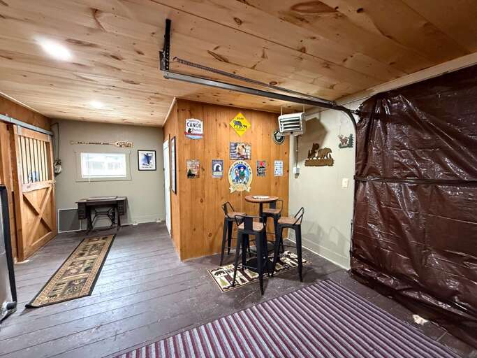3-season living area and gear room. Opens up to the outdoors in summer.