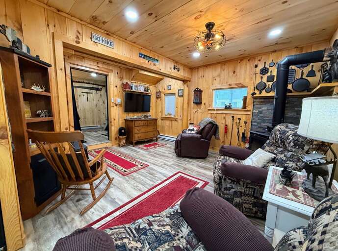 Living area with Wood Stove and Roku TV