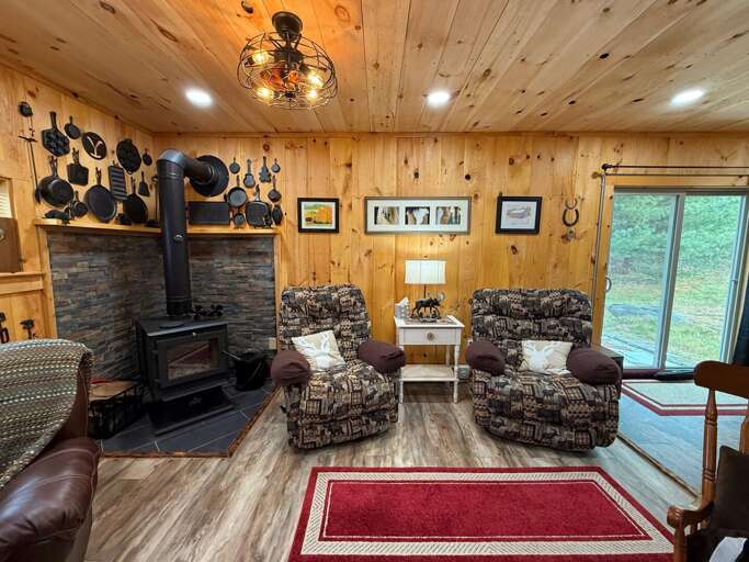 Living area with Wood Stove and Roku TV