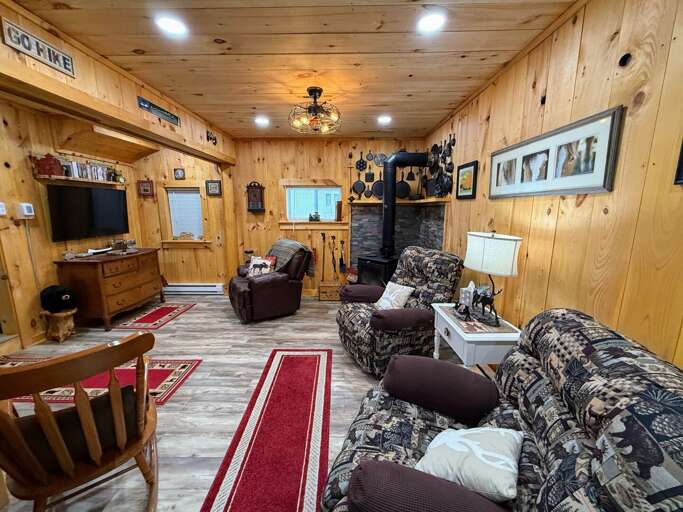 Living area with Wood Stove and Roku TV