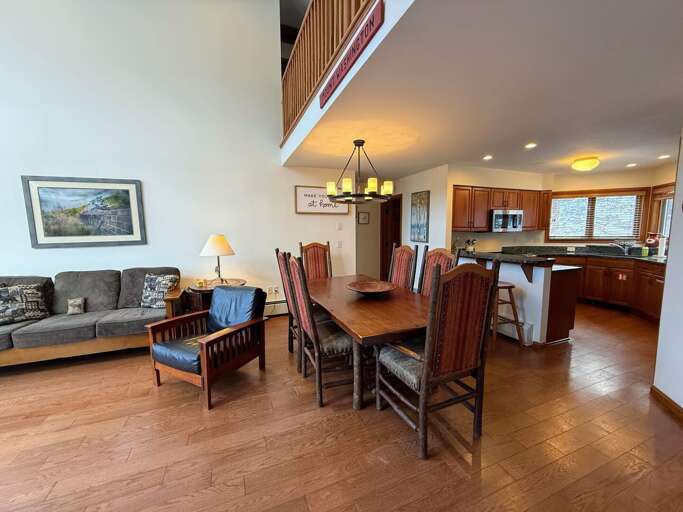 Open concept living, dining and kitchen area with Wood Burning Fireplace and TV