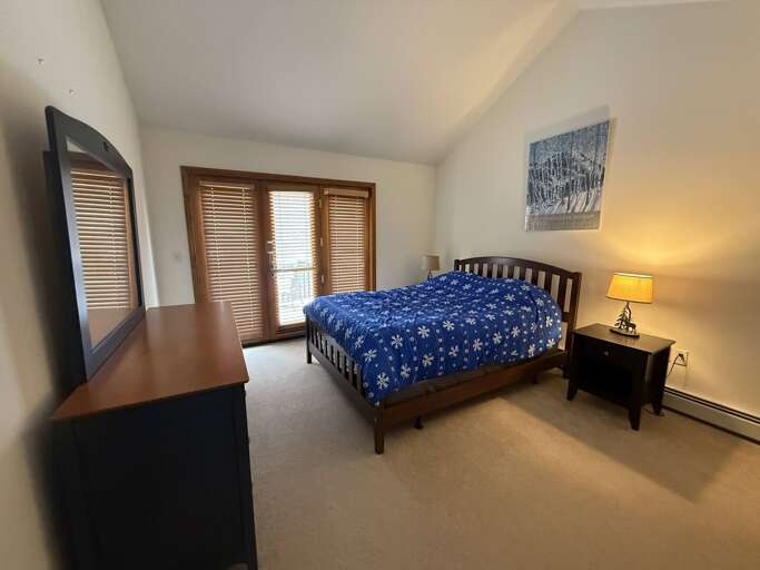 Upper Level Queen Bedroom with Private Deck and direct access to jack-and-jill bathroom