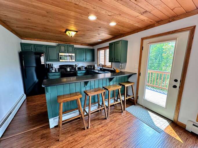 Kitchen area with breakfast bar