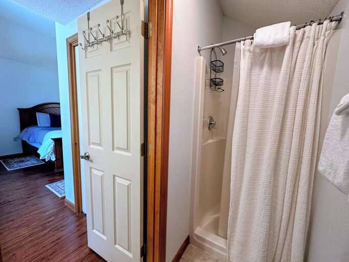 Upper Level Queen Bedroom ensuite bath shower and toilet area