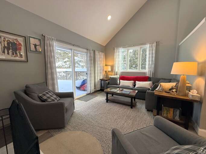 The Main Level Living Area is adjacent to the dining area and kitchen. It offers comfortable