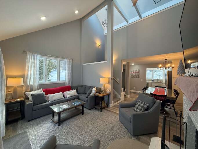 The Main Level Living Area is adjacent to the dining area and kitchen. It offers comfortable