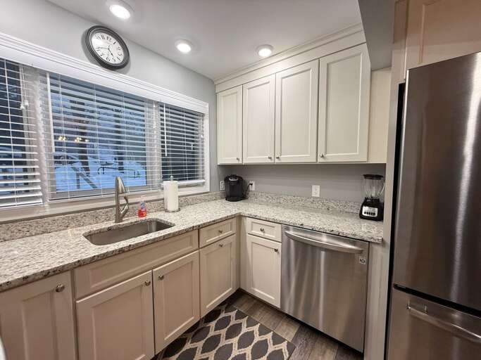 Updated Kitchen with stainless steel appliances and granite countertops.