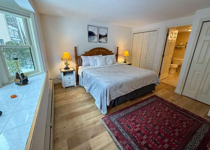 The Main Level Bedroom is equipped with a King bed, dresser and closet, and direct access to a Jack-and-Jill full bath.