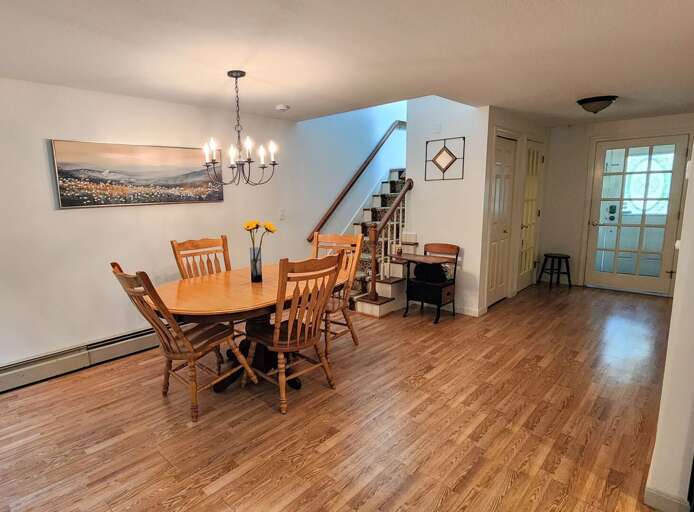 Main Level Dining area with seating for 4 and a few extra chairs are available.