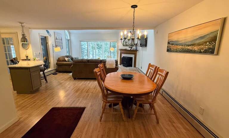 Main Level Dining area with seating for 4 and a few extra chairs are available.