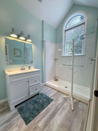 The Upper Level Bathroom is separated into two rooms - one with vanity and shower and the other with a vanity and toilet for easy sharing between the two upper level bedrooms.