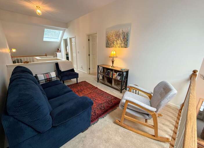 The upper level also offers a loft reading area open to the main level living space.