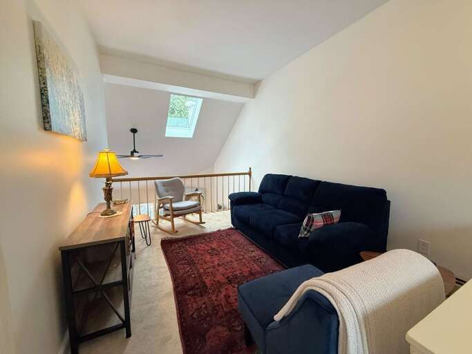 The upper level also offers a loft reading area open to the main level living space.
