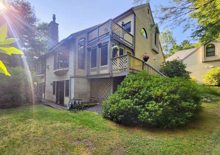 Back yard accessed from lower level walkout and stairs from the main level porch