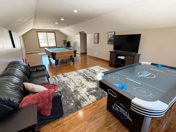 Loft area with TV, Pool Table, Air Hockey Table and exercise bike