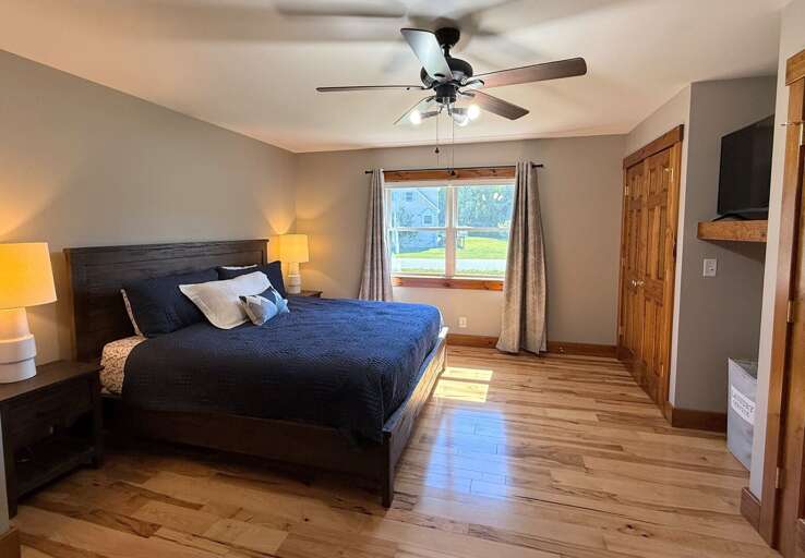 Main Level Primary Bedroom with King Bed, TV and Private Ensuite Bath