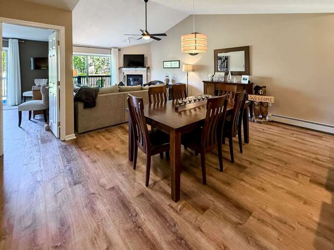 The dining table comfortably sits 6, and 5 additional seats are available at the bar counter