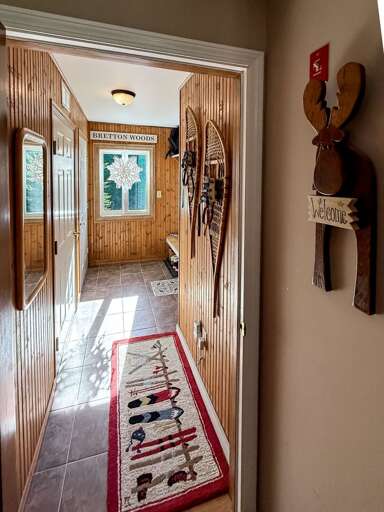 With rustic decor and lots of wood, the mudroom welcomes you with a mountain feel that will melt your stress away