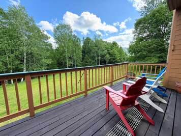 The main level deck offers forest views with a peek over to the Bretton Woods Ski Area