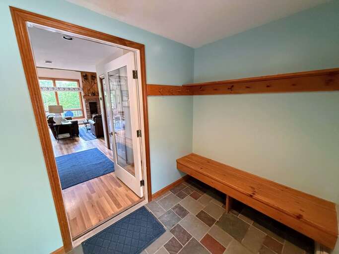 Mudroom on the main level. Just a few steps down from the parking area. 2 cars only in this lot with overflow spaces available nearby.