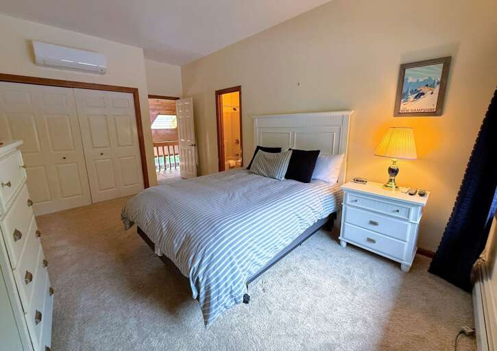 Upper Level Bedrooms both have Queen beds, TVs, and ensuite baths.