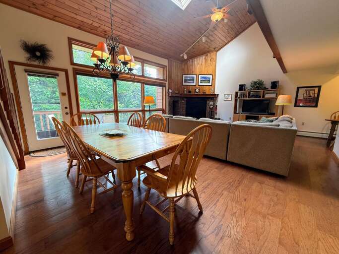 Main living area is an open concept space with living area, dining, breakfast bar, and kitchen right as you walk in.