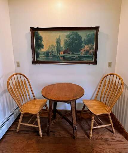 A small nook behind the couch offers a comfy place for a game of cards or chess.