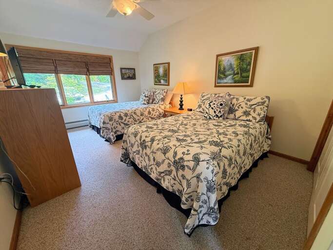 Upper Level Double Bedroom with two double beds and ensuite bath