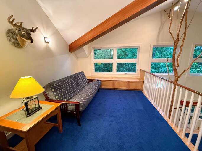 The loft has a sitting area that can fold out into a sleeping area as well.
