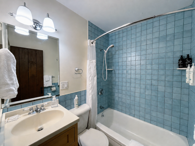 Main level shared bath with shower/tub combo.