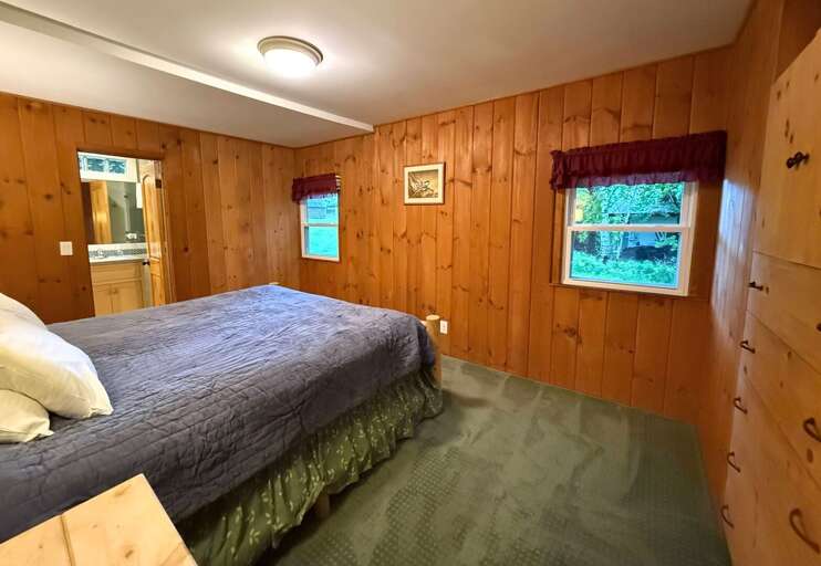 The primary bedroom has a Queen bed and ensuite bathroom with shower.