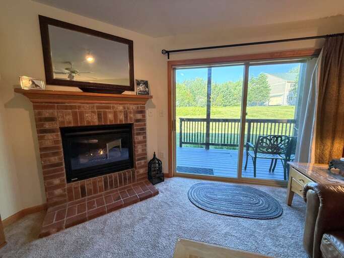 A cozy gas fireplace accents the living room especially on a snowy winter day.