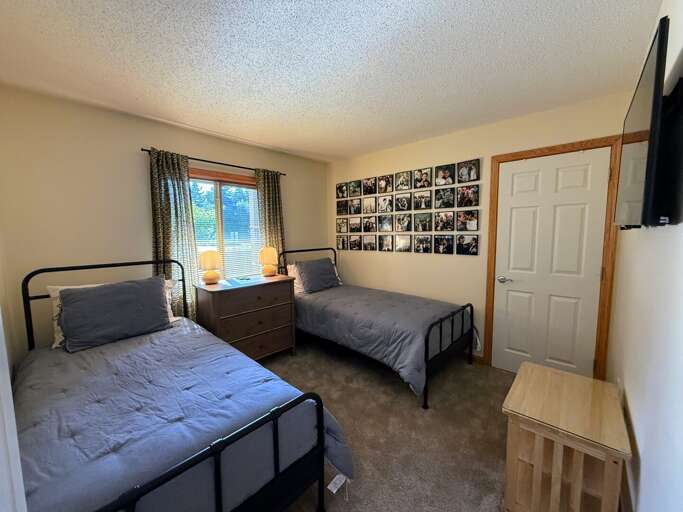 Twin Bedroom with 2 twin beds and TV
