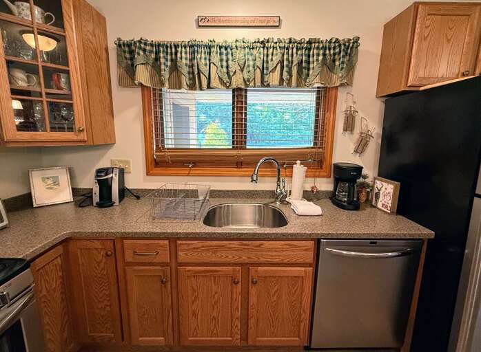 Kitchen window looks out towards the parking area and entry.