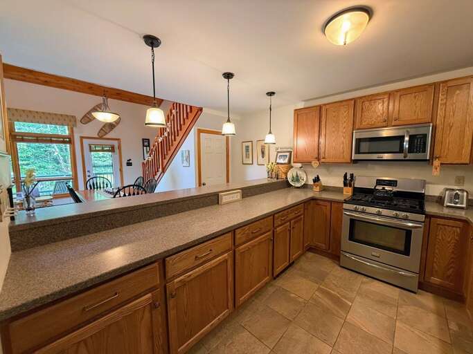 Lots of counter space and stainless steel appliances make this a very comfortable kitchen.