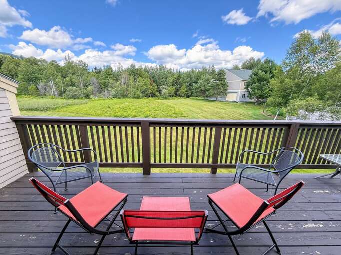 Back deck with seating.